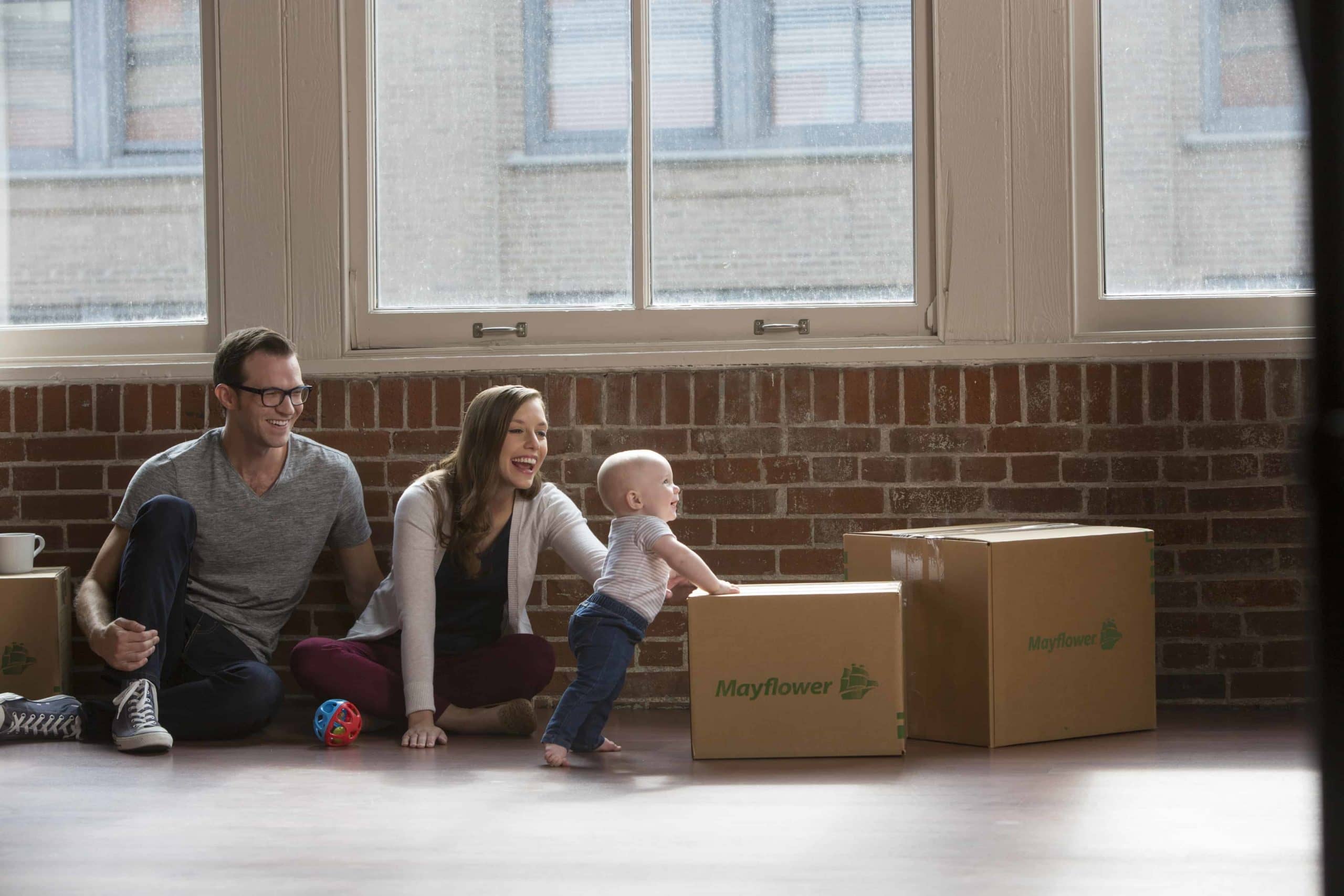 How To Move With A Baby - young couple with a toddler using a box to standup - Mayflower