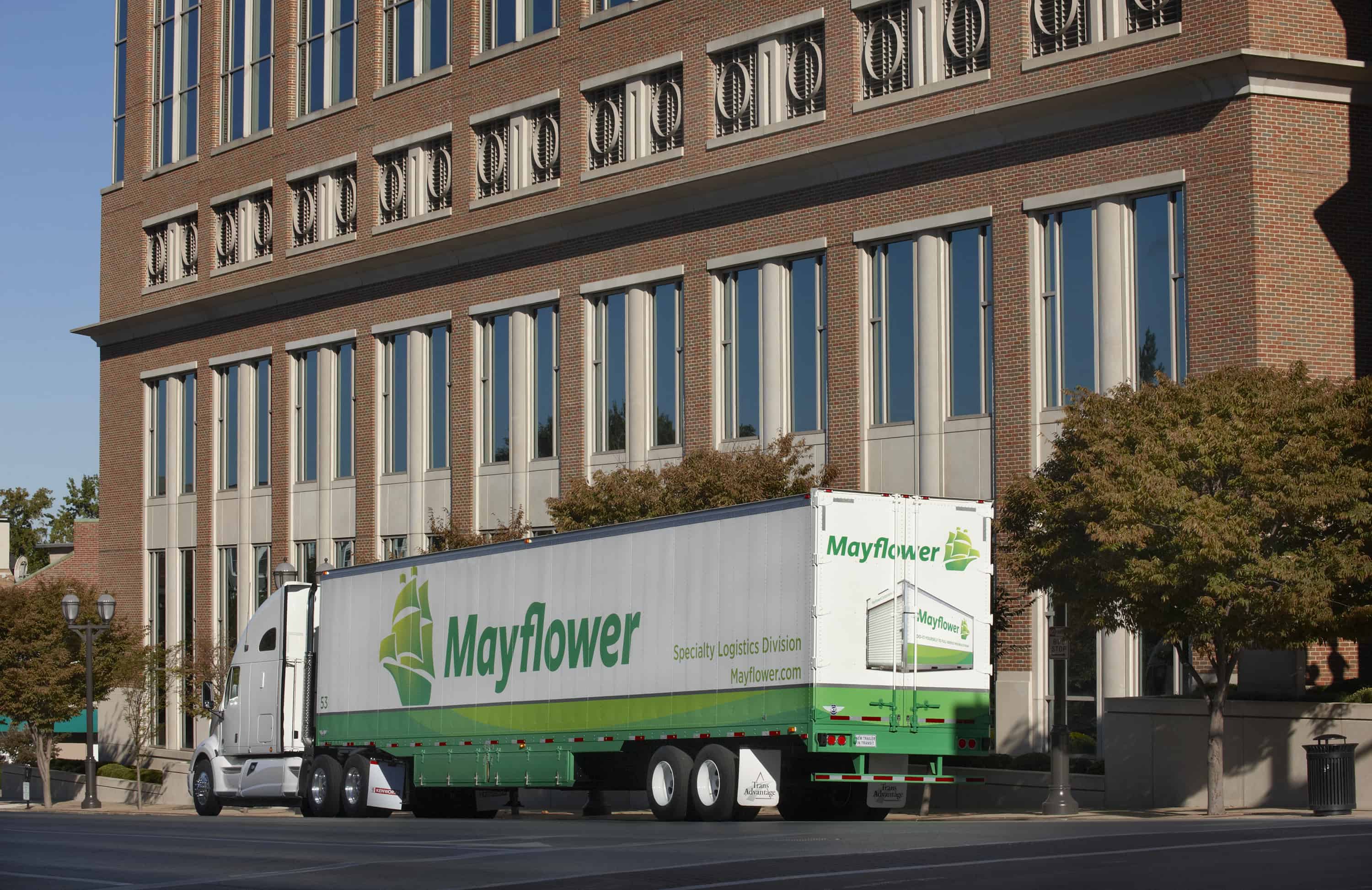 Mayflower moving truck in front of a high rise building - Mayflower®