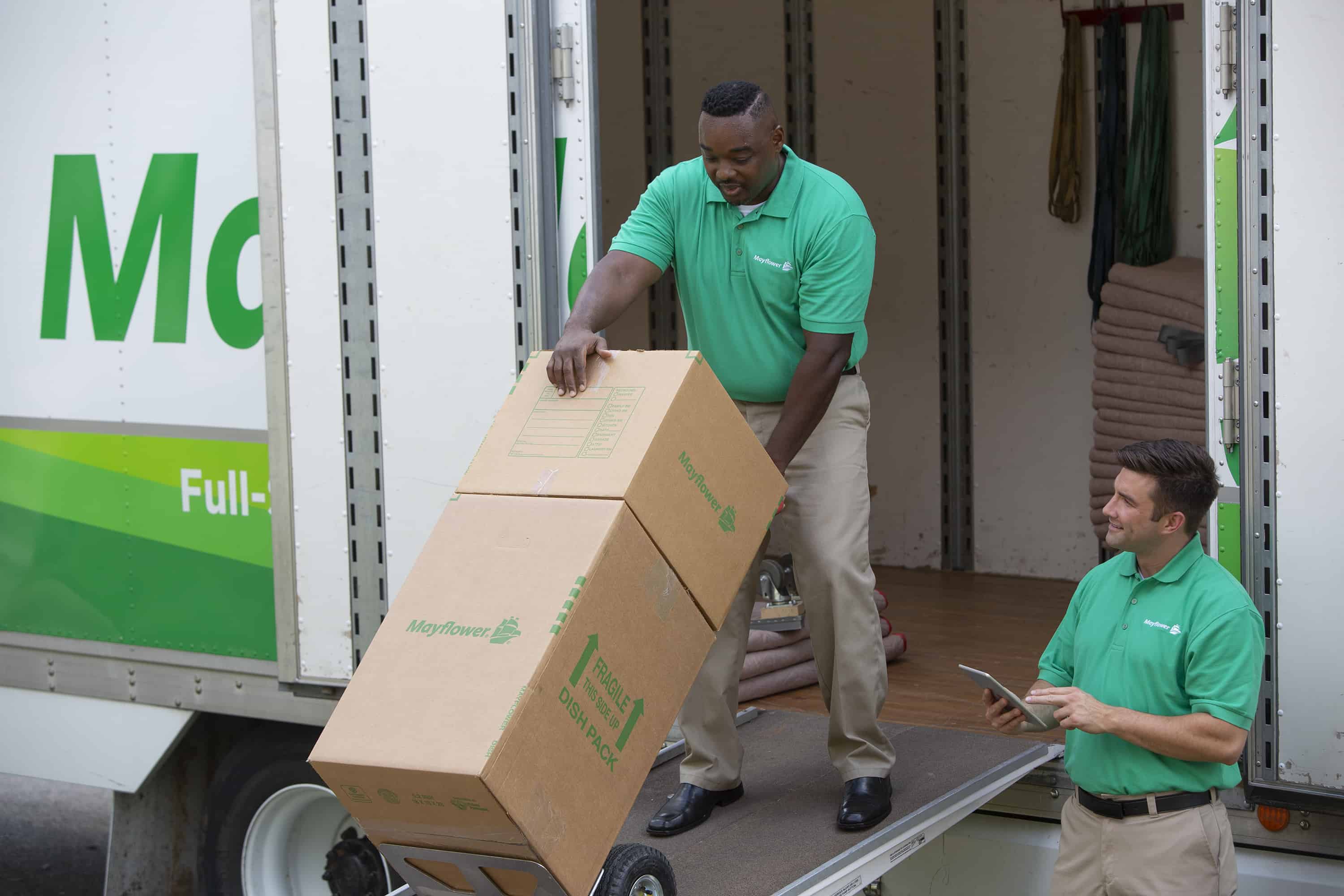 two movers loading up a moving truck - Mayflower®