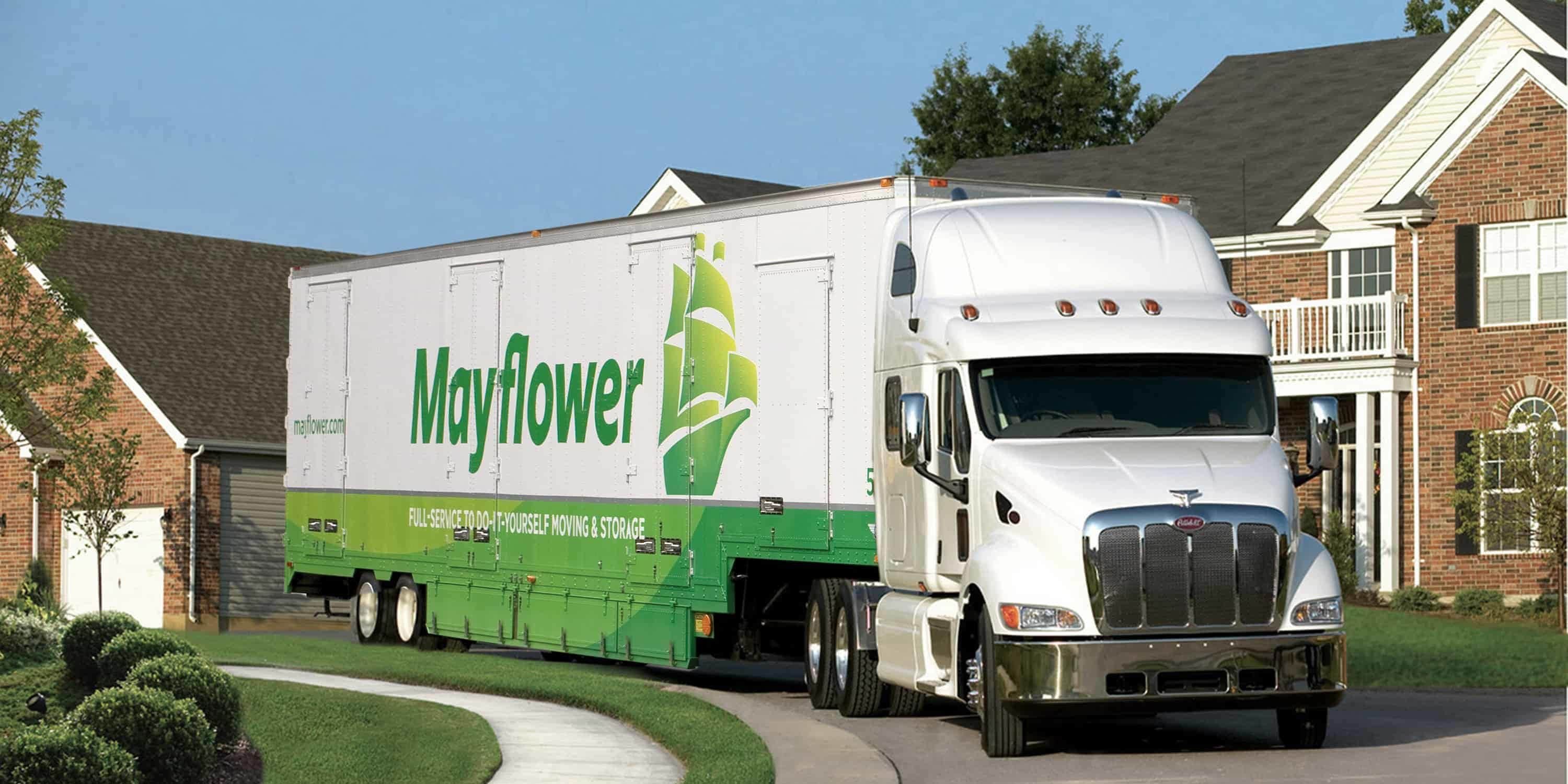 Mayflower truck driving down a residential street - Mayflower