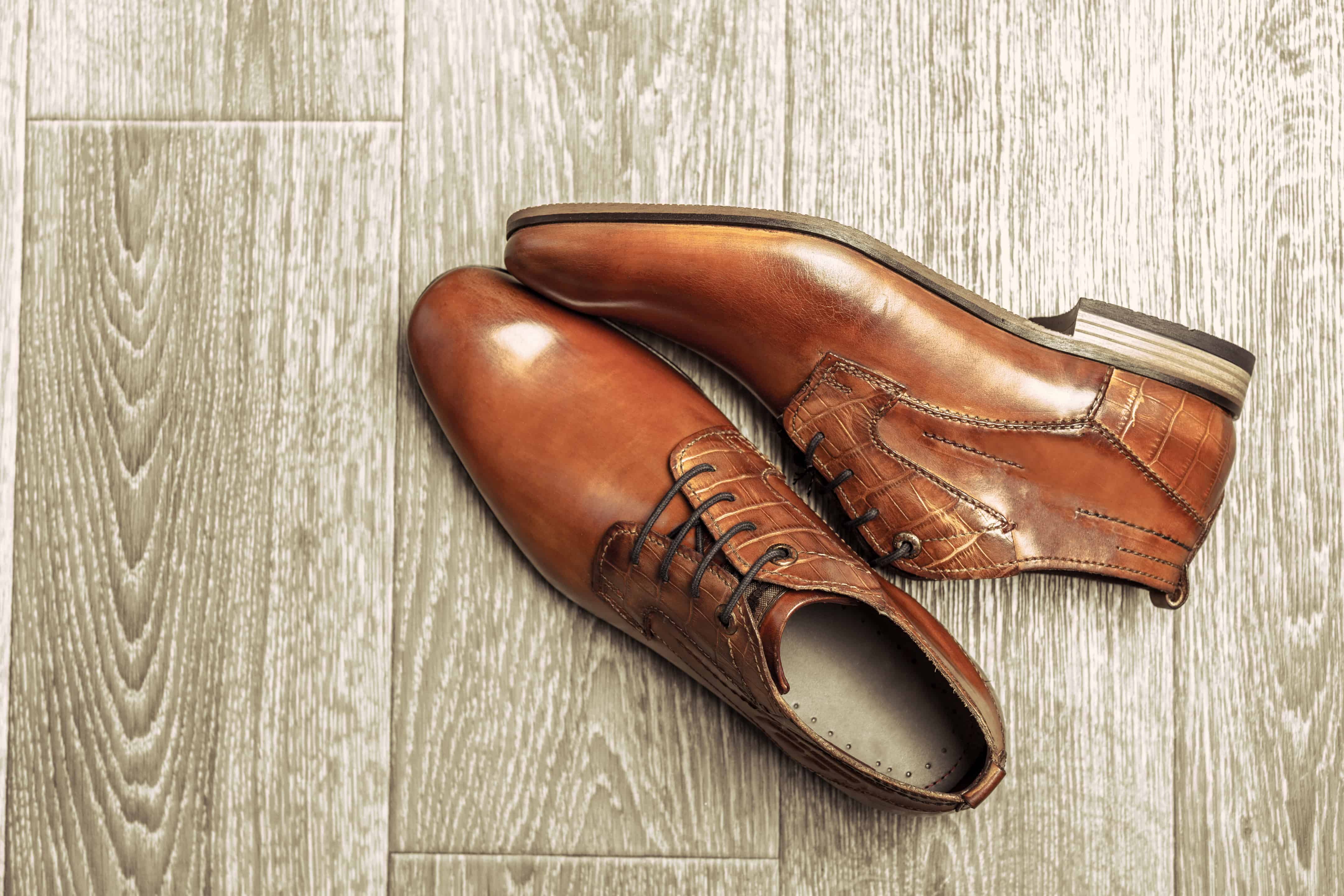How to Pack Shoes - Fashion concept with male shoes on wooden background - Mayflower