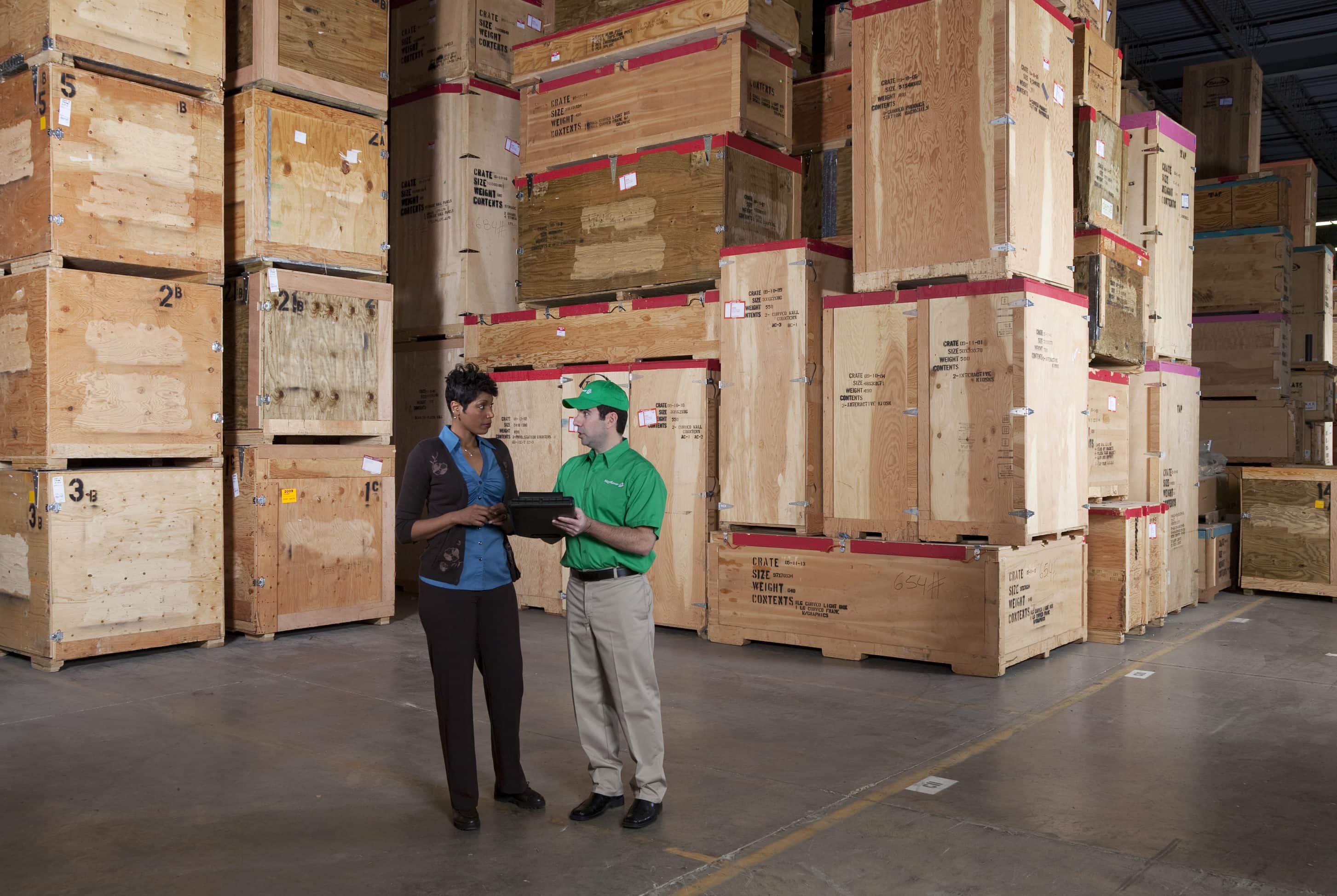 Logistics Company - Mayflower logistics specialist speaking with a tradeshow customer - Mayflower®